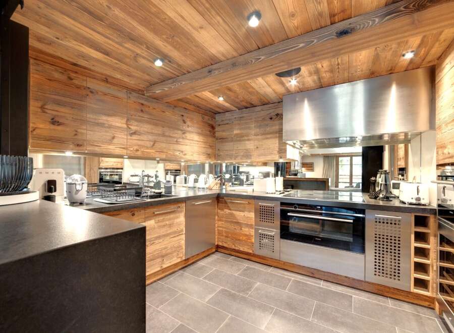 This stunning kitchen boasts a rustic, yet modern design, perfect for any home.