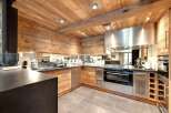 This stunning kitchen boasts a rustic, yet modern design, perfect for any home.