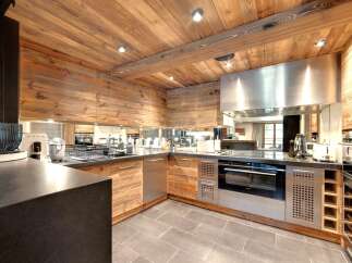 This stunning kitchen boasts a rustic, yet modern design, perfect for any home.