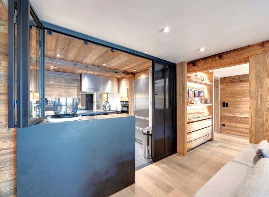 This stunning property boasts a modern kitchen with stainless steel appliances and a sleek design.