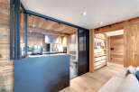 This stunning property boasts a modern kitchen with stainless steel appliances and a sleek design.