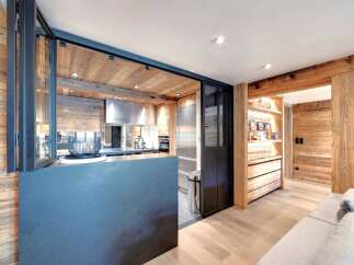 This stunning property boasts a modern kitchen with stainless steel appliances and a sleek design.