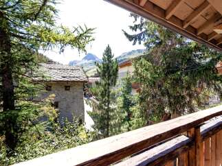 Enjoy breathtaking mountain views from this charming property.