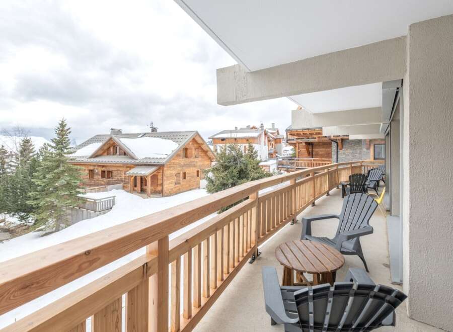 Enjoy breathtaking mountain views from this charming balcony.