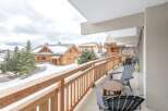 Enjoy breathtaking mountain views from this charming balcony.