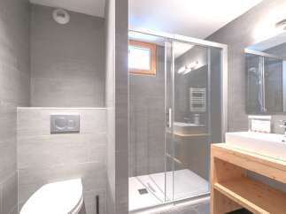 Step into a modern bathroom oasis, featuring sleek gray tile and a glass-enclosed shower.