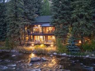 Nestled amidst lush greenery, this stunning property offers a serene escape.