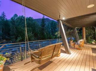 Experience the tranquility of riverside living with this stunning property.