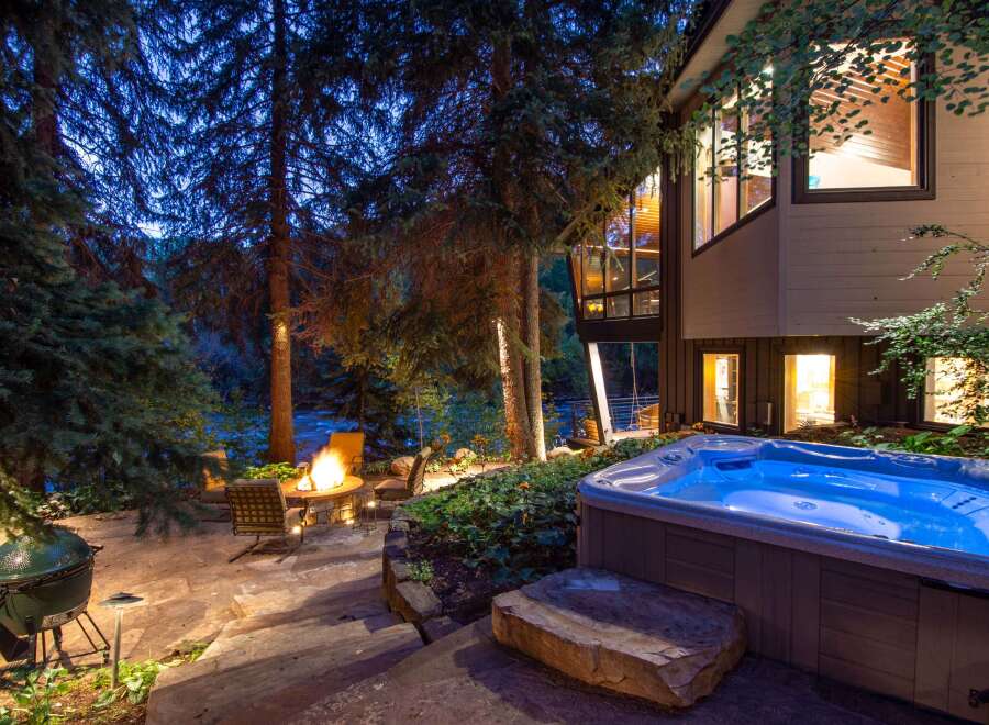 Experience luxury living in this stunning property featuring a private hot tub, perfect for unwinding after a long day.
