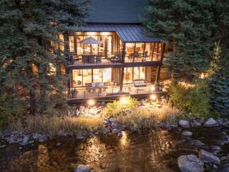 Nestled amidst lush greenery, this stunning property offers a serene escape with its modern design and inviting ambiance.