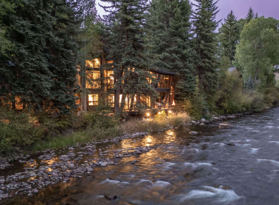 Nestled amidst lush greenery, this stunning property offers a serene escape with its riverfront location.
