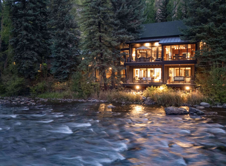 Nestled amidst lush greenery, this stunning property offers a serene escape with its riverfront location.