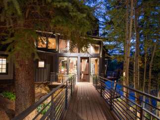 Nestled amidst lush greenery, this stunning property offers a serene escape.