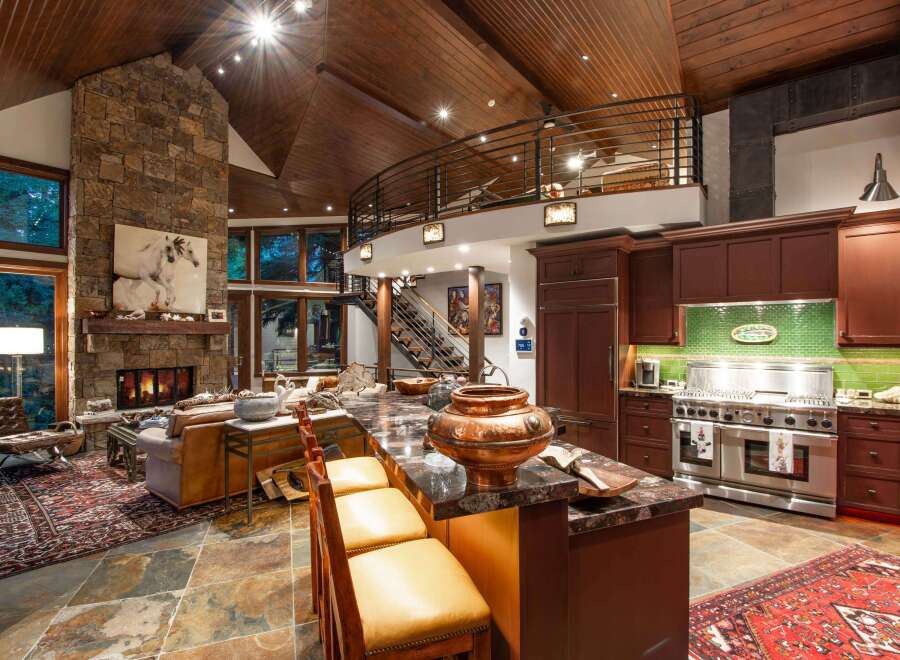 Experience luxury living in this stunning property featuring a gourmet kitchen with a large island and high-end appliances.