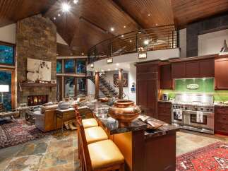 Experience luxury living in this stunning property featuring a gourmet kitchen with a large island and high-end appliances.