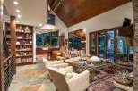 This luxurious living space showcases a stunning blend of rustic charm and modern elegance.