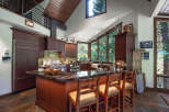This stunning kitchen boasts a warm and inviting atmosphere, perfect for culinary enthusiasts.