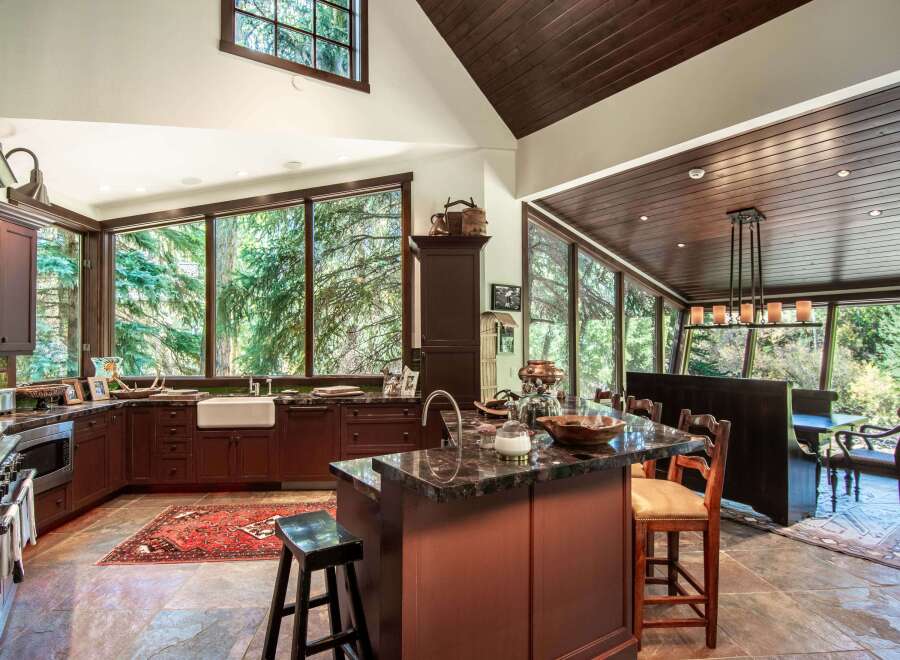 This stunning kitchen boasts a seamless blend of rustic charm and modern elegance.