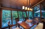 Experience the tranquility of riverside living in this stunning dining room.