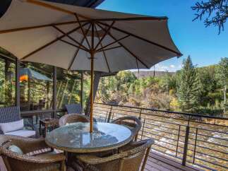 Enjoy the tranquility of riverside living with this stunning property.