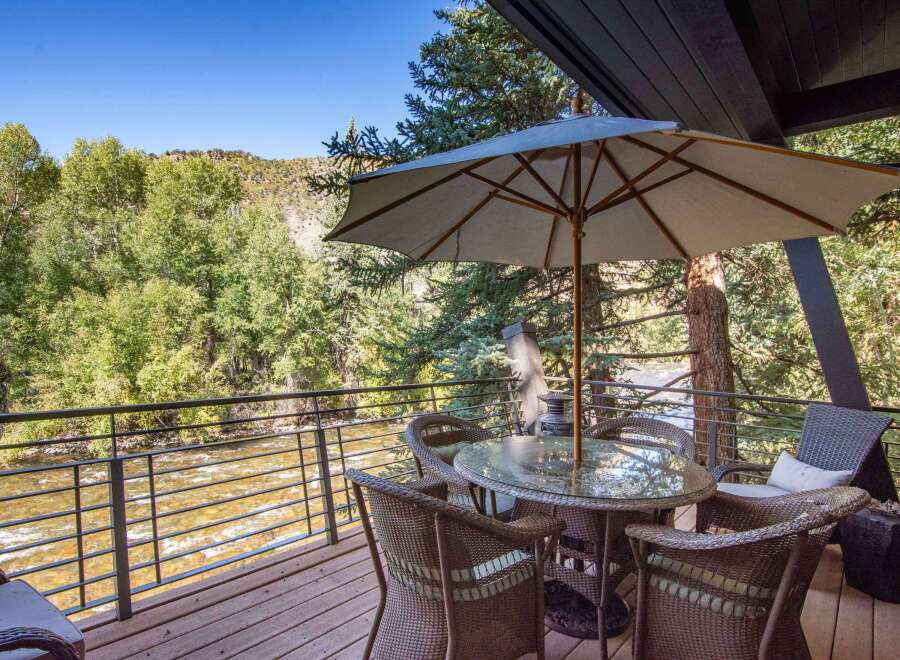 Enjoy breathtaking views from this stunning property overlooking a flowing river.