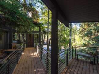 Experience the tranquility of this stunning property, nestled amidst lush greenery and offering breathtaking views.