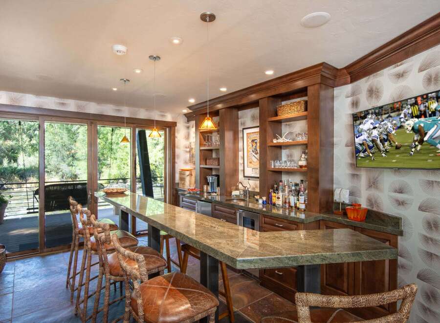 This stunning bar area is the perfect space for entertaining guests.