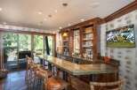 This stunning bar area is the perfect space for entertaining guests.