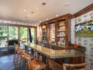 This stunning bar area is the perfect space for entertaining guests.