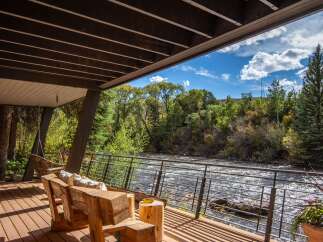 Experience the tranquility of riverside living in this stunning property.