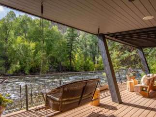 Experience the tranquility of riverside living in this stunning property.