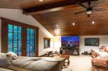 This stunning living space boasts a warm and inviting atmosphere, perfect for relaxation and entertainment.