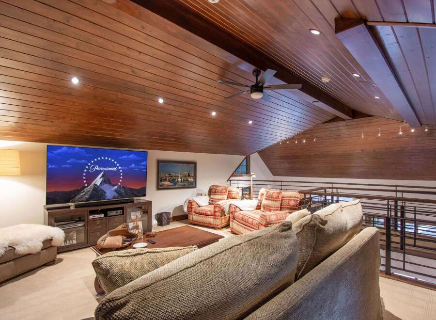Experience luxury living in this stunning property featuring a spacious living area with a cozy seating arrangement.
