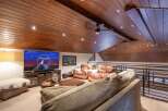 Experience luxury living in this stunning property featuring a spacious living area with a cozy seating arrangement.