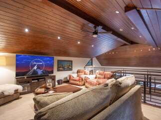 Experience luxury living in this stunning property featuring a spacious living area with a cozy seating arrangement.