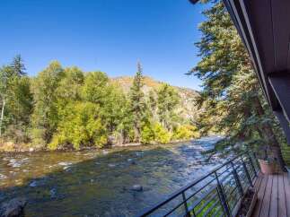 Experience the tranquility of riverside living in this stunning property.