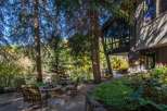 Escape to your dream home with this stunning property! Enjoy the tranquility of nature with a cozy outdoor seating area, perfect for relaxation.