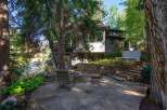 Nestled in a serene natural setting, this property offers a unique blend of comfort and outdoor living.
