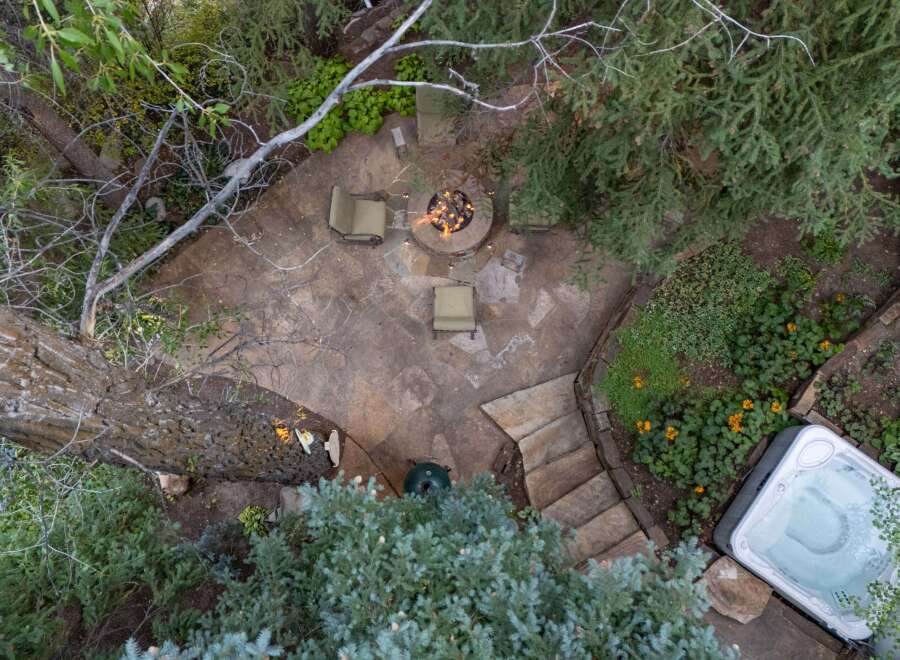 Enjoy the ultimate outdoor oasis with this stunning property! Featuring a cozy fire pit, perfect for gatherings, and a relaxing hot tub, ideal for unwinding.