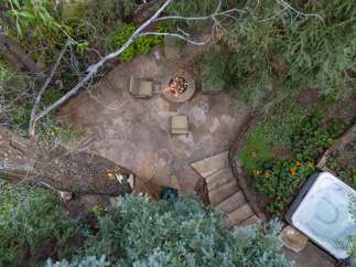 Enjoy the ultimate outdoor oasis with this stunning property! Featuring a cozy fire pit, perfect for gatherings, and a relaxing hot tub, ideal for unwinding.