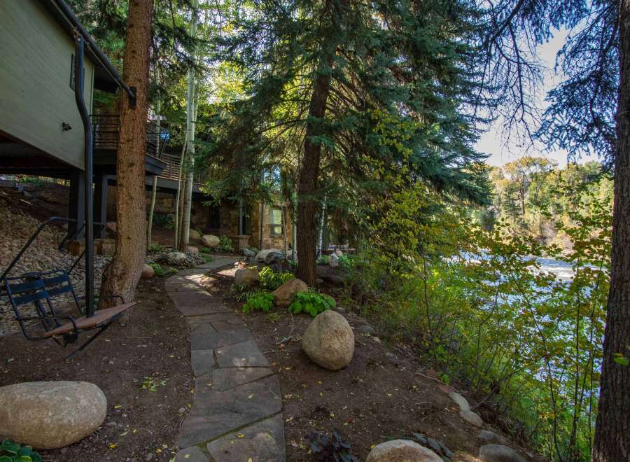Escape to your dream home nestled in a serene, wooded setting.