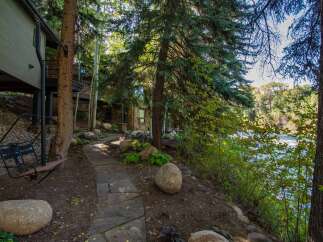 Escape to your dream home nestled in a serene, wooded setting.