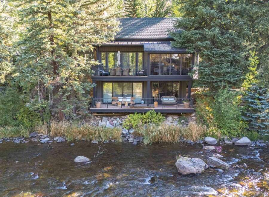 Nestled amidst lush greenery, this stunning property offers a serene retreat with breathtaking river views.