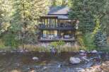 Nestled amidst lush greenery, this stunning property offers a serene retreat with breathtaking river views.