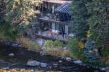 Nestled along a serene river, this stunning property offers a unique blend of natural beauty and modern design.