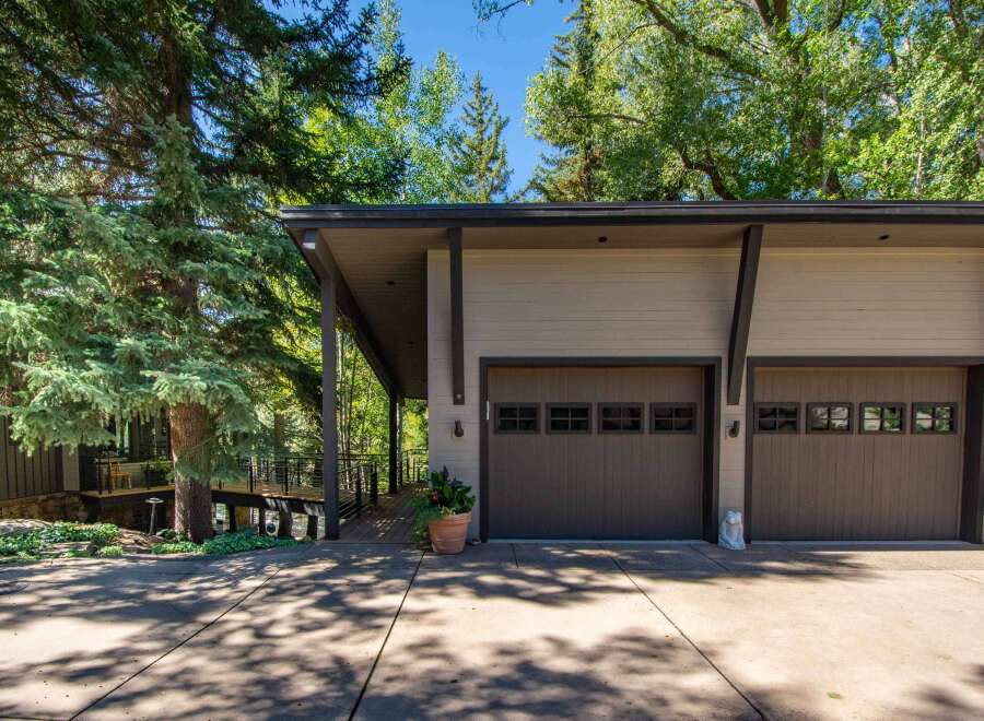 Discover the charm of this stunning property, featuring a modern garage with ample space for vehicles and storage.