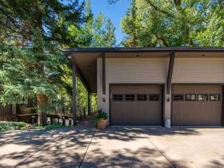 Discover the charm of this stunning property, featuring a modern garage with ample space for vehicles and storage.