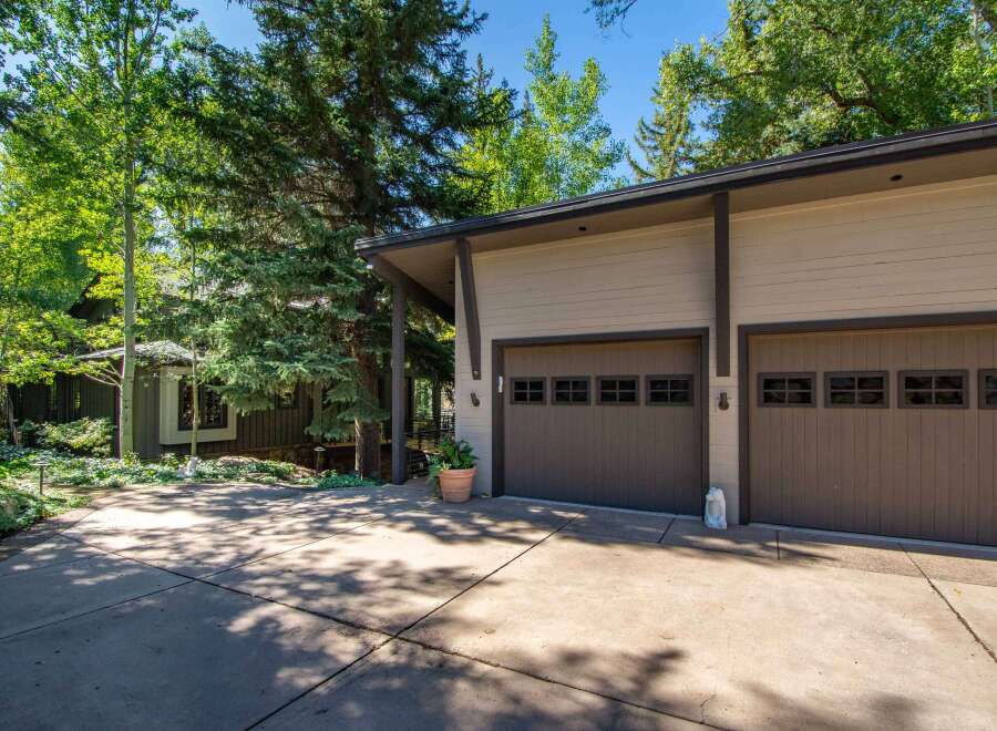 This stunning property boasts a modern garage with ample space for vehicles and storage.