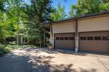 This stunning property boasts a modern garage with ample space for vehicles and storage.