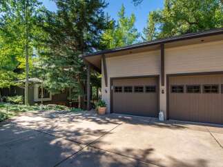 This stunning property boasts a modern garage with ample space for vehicles and storage.